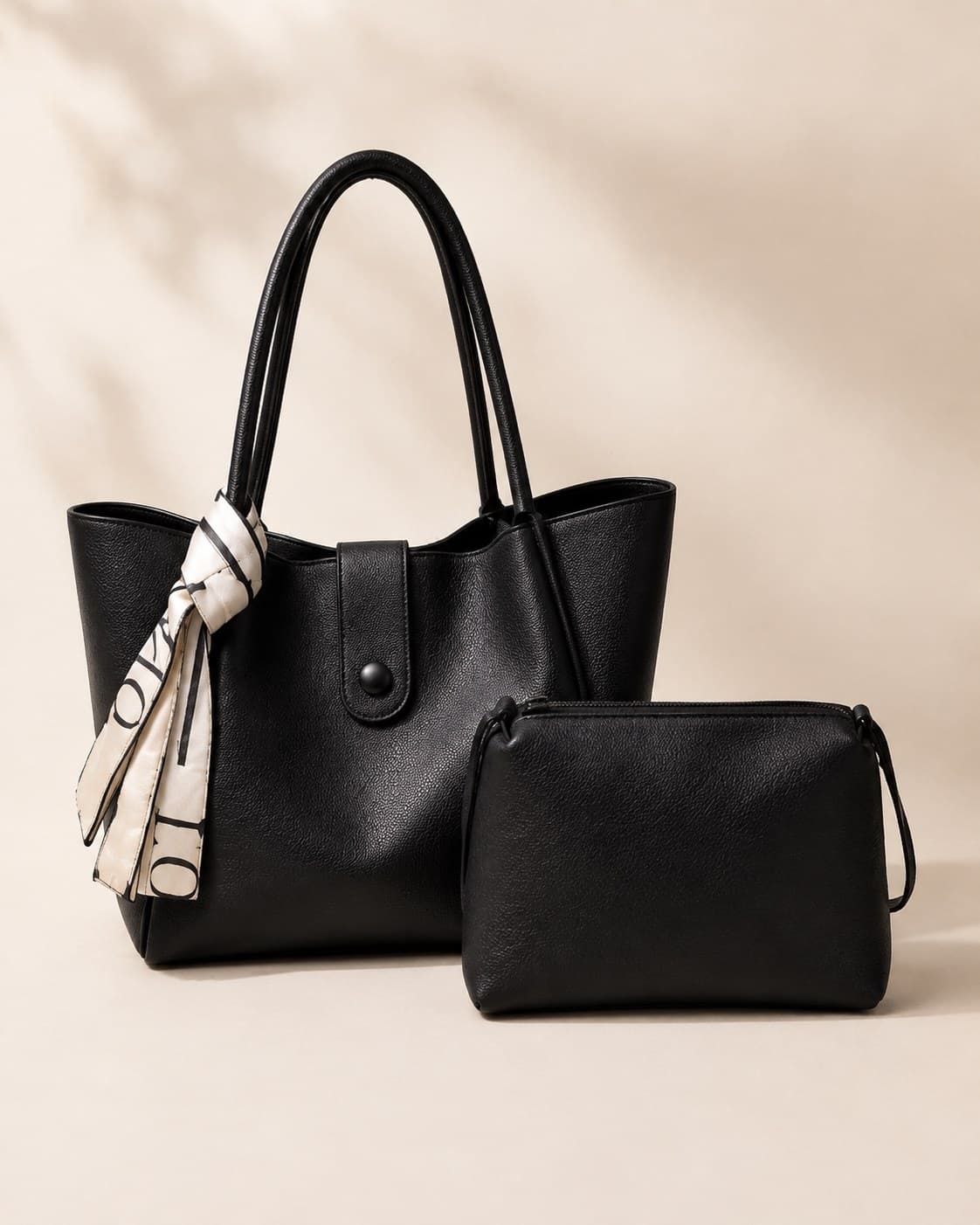 The Everyday Tote in Noir with its Mini Essentials Pouch